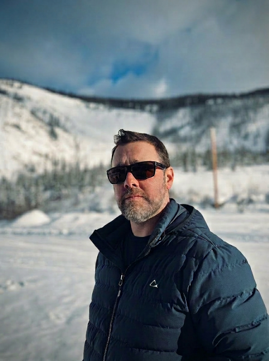 Adam Naugler outdoors in winter mountains